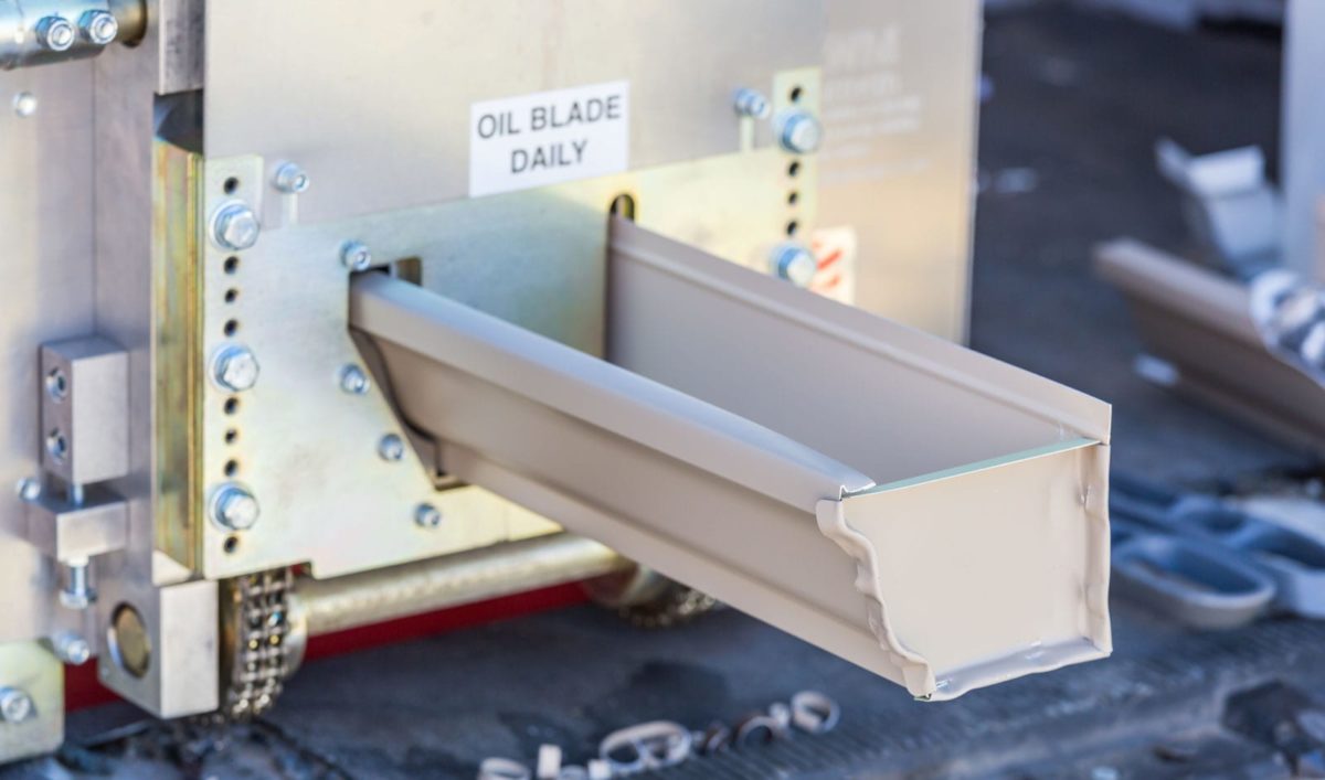 Seamless aluminum gutter material prepared for installation